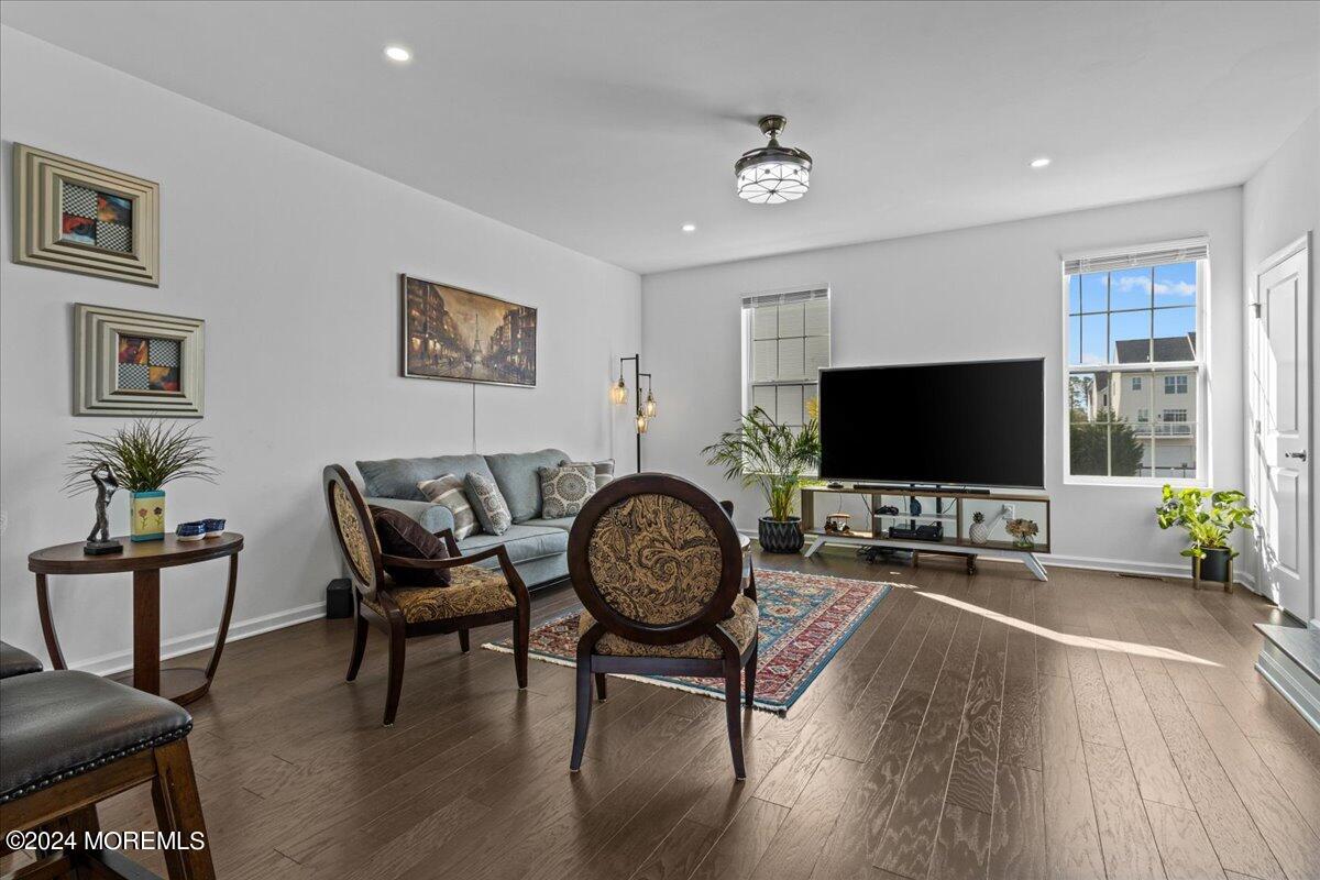 104 Prestige Road Brick, NJ 08723 - Photo 13 of 43 a living room with furniture and a flat screen tv