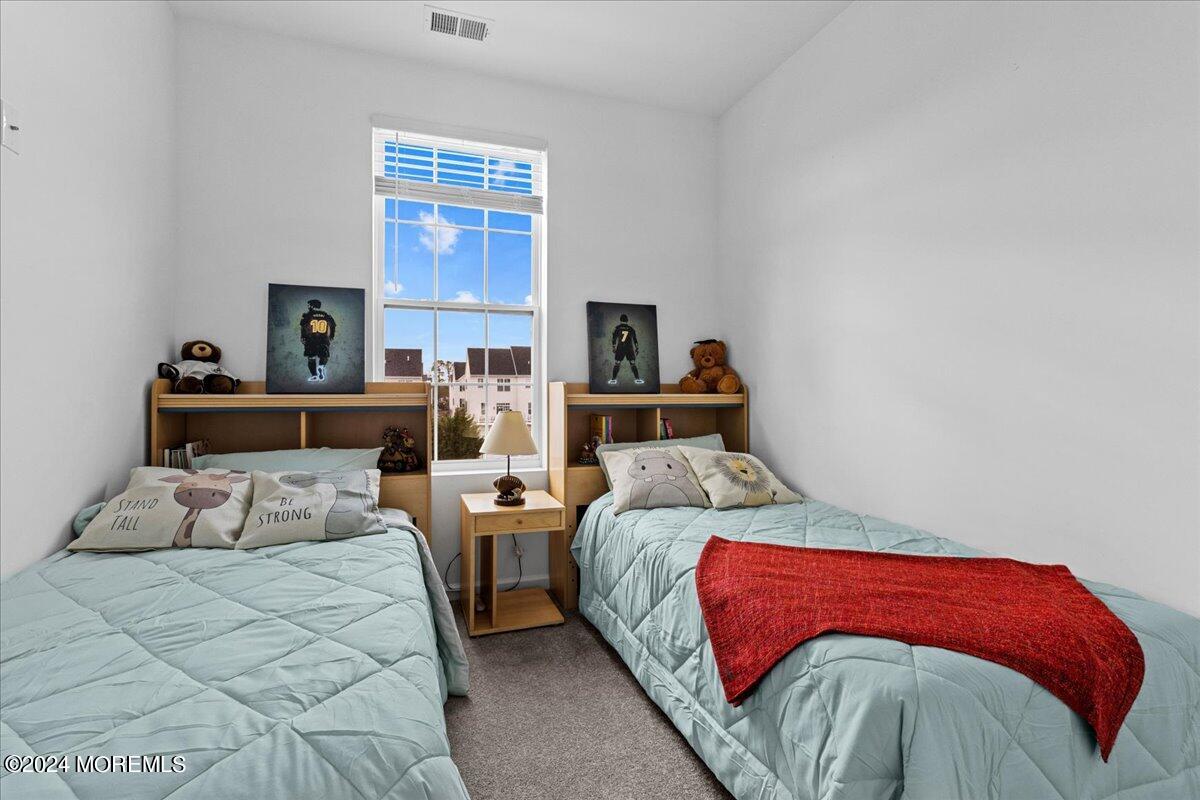104 Prestige Road Brick, NJ 08723 - Photo 20 of 43 a bedroom with a large bed and a window