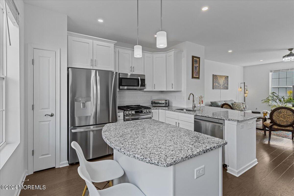104 Prestige Road Brick, NJ 08723 - Photo 2 of 43 a kitchen with stainless steel appliances granite countertop a stove refrigerator sink and cabinets