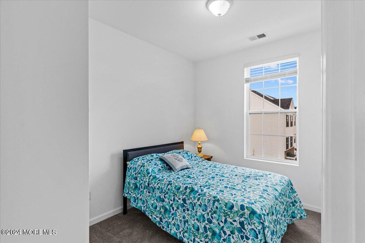 104 Prestige Road Brick, NJ 08723 - Photo 22 of 43 a bedroom with a bed and a window