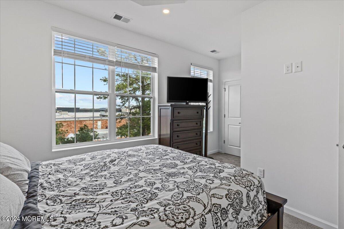 104 Prestige Road Brick, NJ 08723 - Photo 23 of 43 a bedroom with a bed and a television