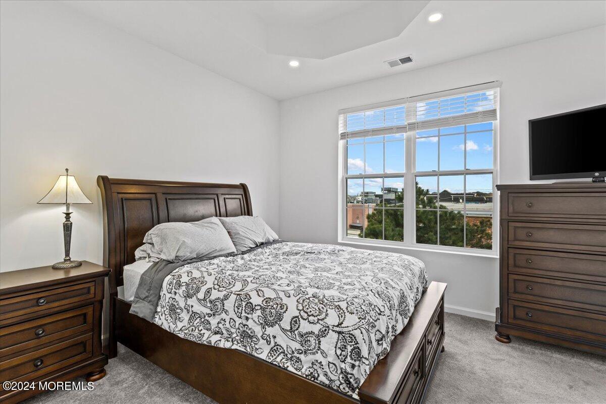 104 Prestige Road Brick, NJ 08723 - Photo 24 of 43 a bedroom with a bed and a flat tv screen
