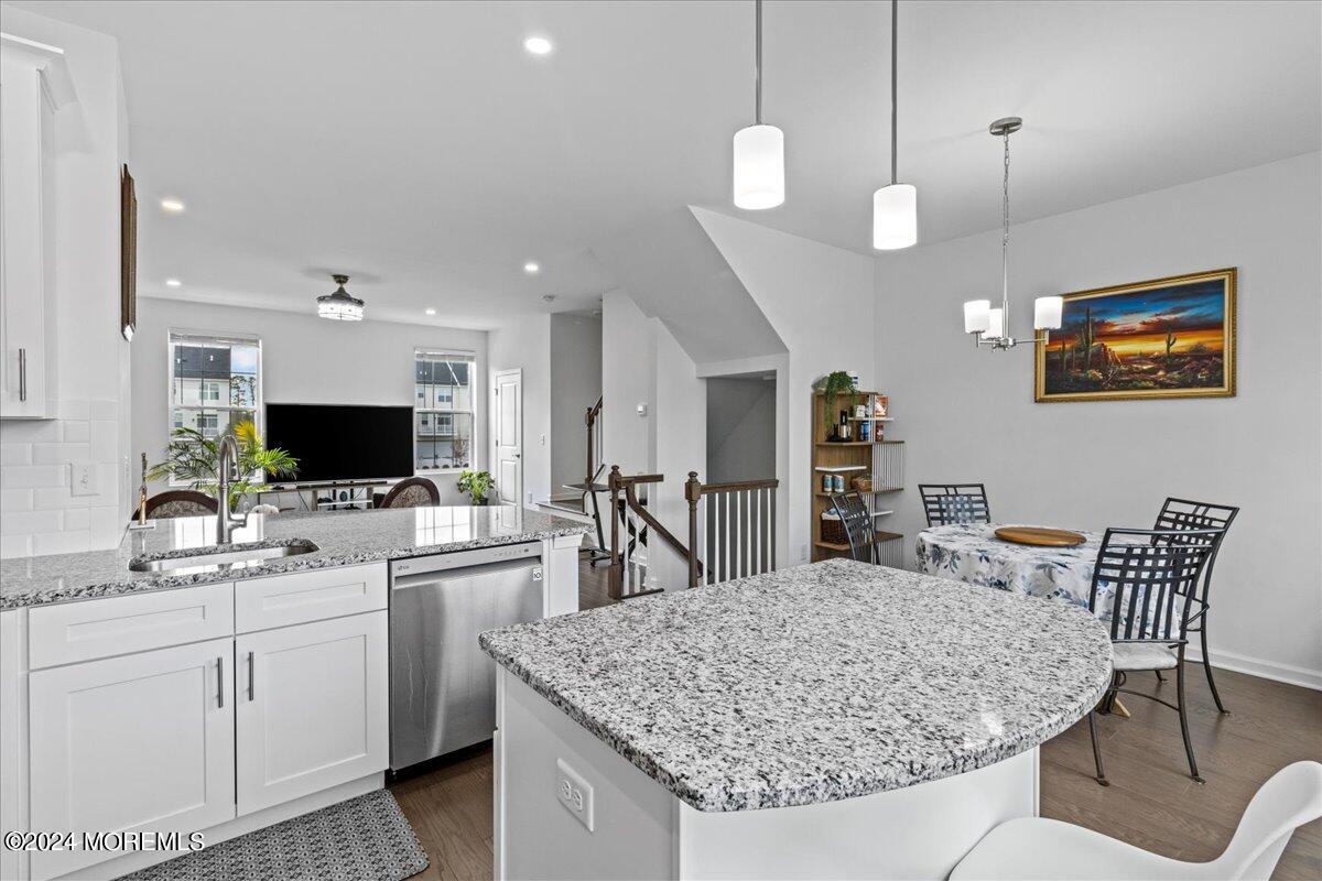 104 Prestige Road Brick, NJ 08723 - Photo 5 of 43 a kitchen with a table and chairs