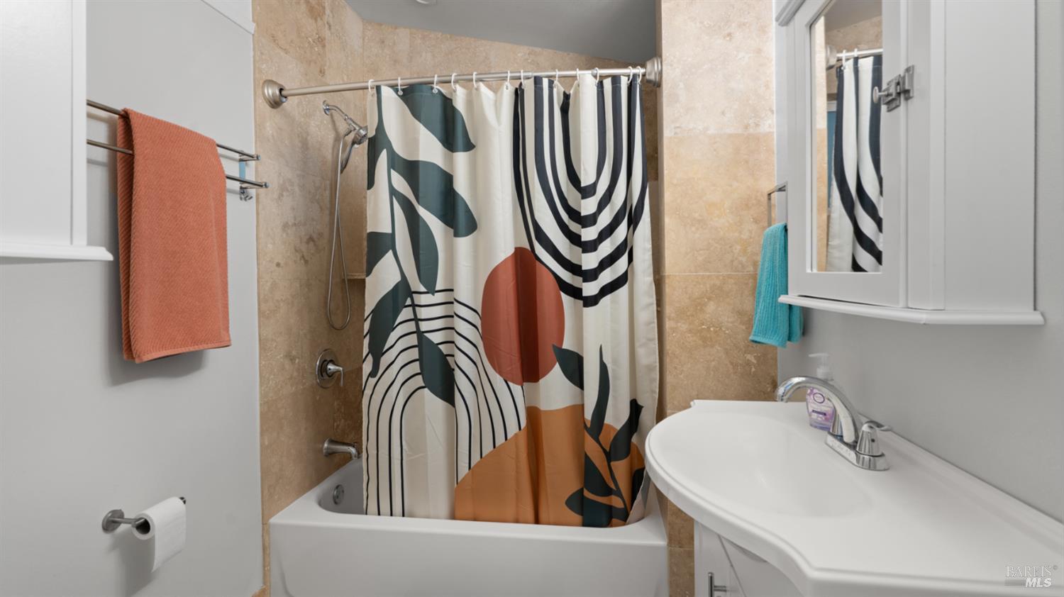 15246 Rio Nido Road Guerneville, CA 95446 - Photo 14 of 24 a bathroom with a sink a mirror and a window