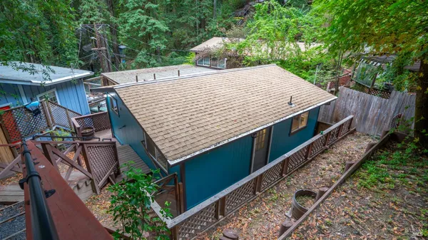 an aerial view of a house with a yard