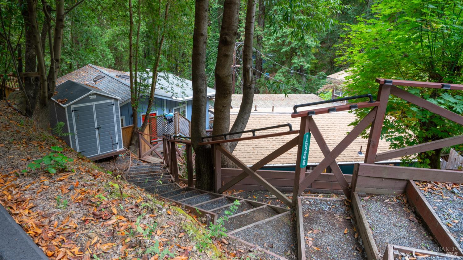 15246 Rio Nido Road Guerneville, CA 95446 - Photo 19 of 24 a view of a chairs and table in the backyard