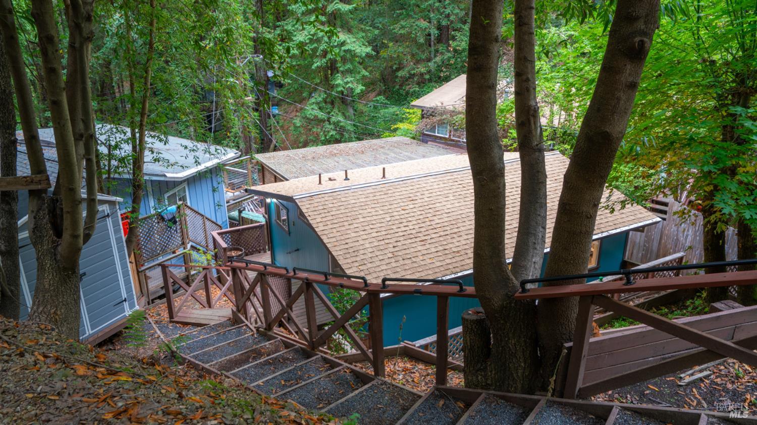 15246 Rio Nido Road Guerneville, CA 95446 - Photo 20 of 24 an outdoor space with seating area and trees