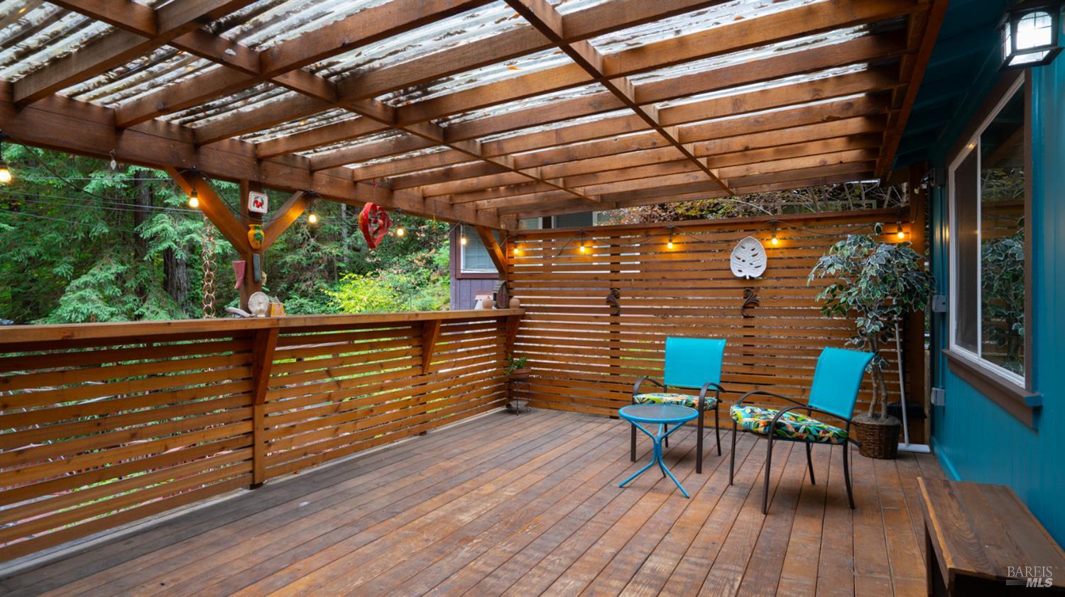 15246 Rio Nido Road Guerneville, CA 95446 - Photo 2 of 24 a view of a chairs and table in the balcony