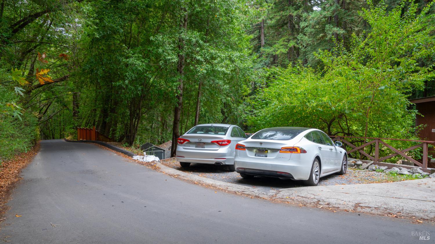 15246 Rio Nido Road Guerneville, CA 95446 - Photo 21 of 24 a front view of a house with cars parked on road