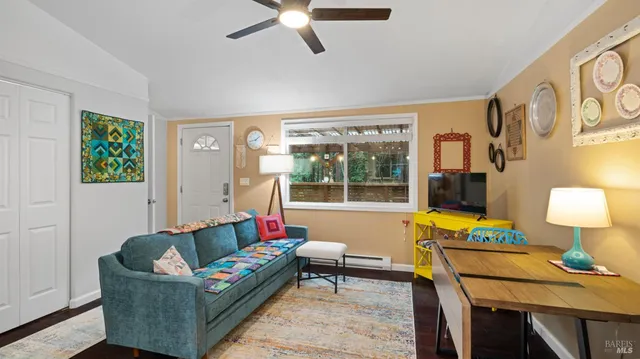 a living room with furniture and a lamp