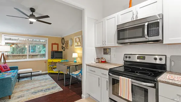 a kitchen with a stove and a microwave