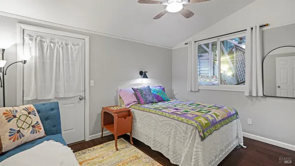 a bedroom that has a bed and a chandelier