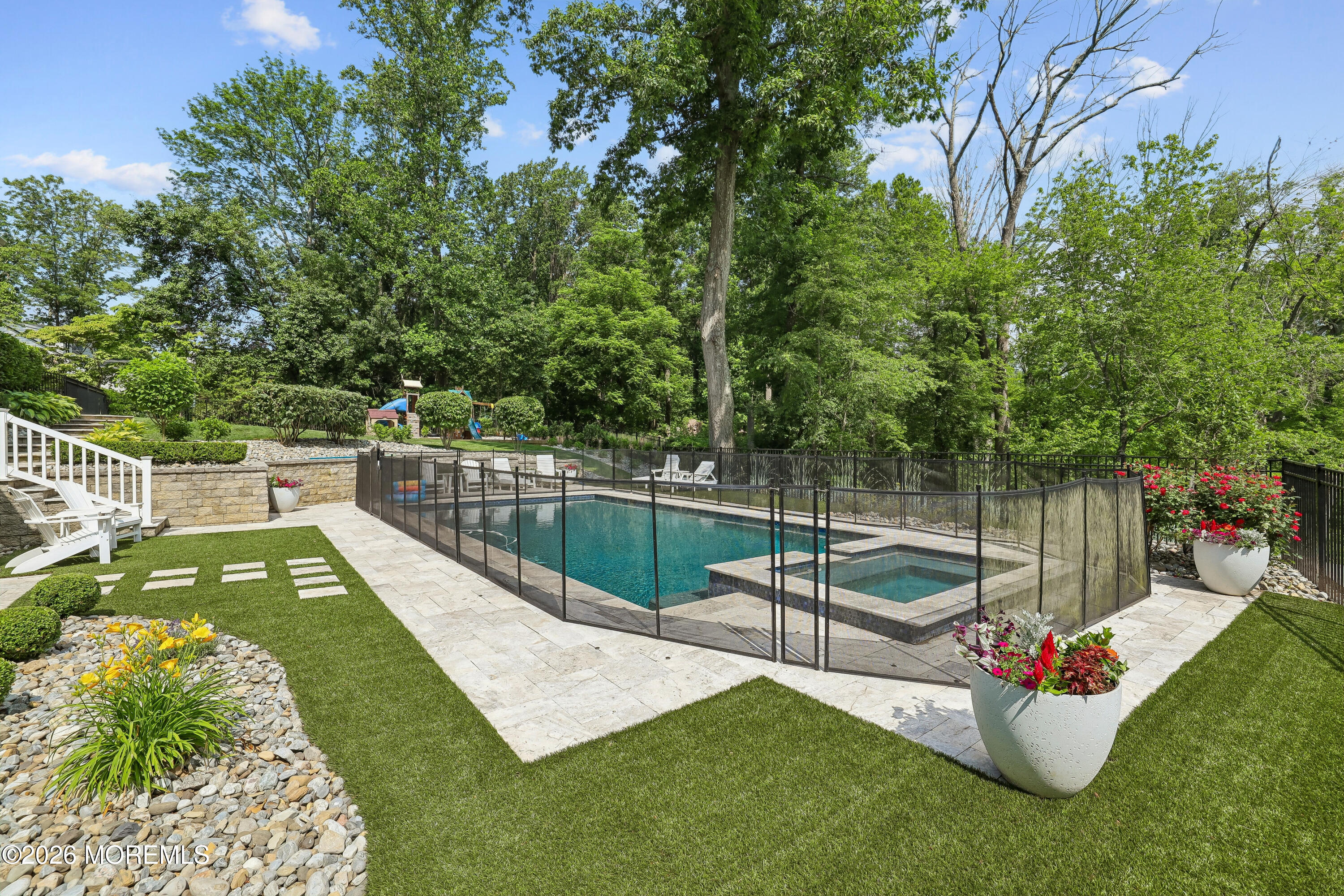 92 Tulip Lane Colts Neck, NJ 07722 - Photo 45 of 55 a view of a swimming pool with a patio