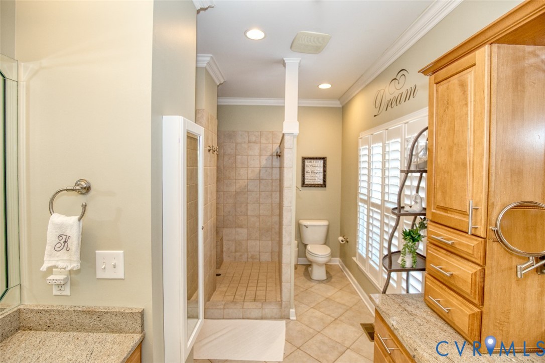 9960 Mill Pond Road Toano, VA 23168 - Photo 23 of 42 Tiled walk-in shower, crown molding, plantation sh