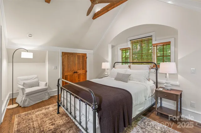 a bedroom with a bed and a couch