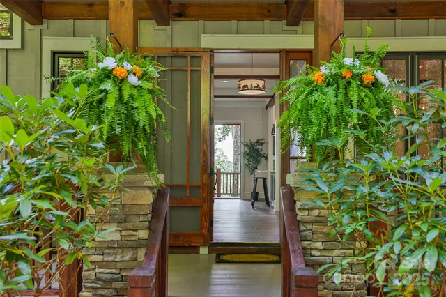 a view of a balcony with chair and wooden floor