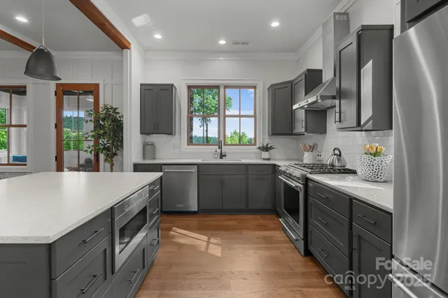 a kitchen with a sink stove and cabinets