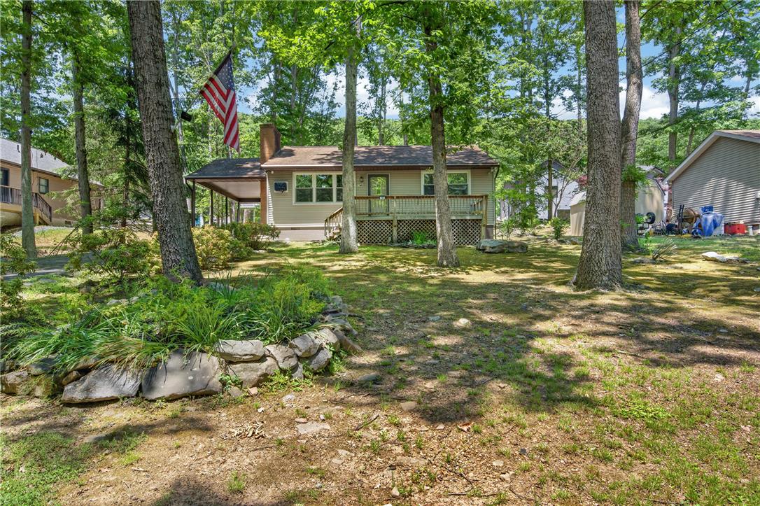 18 White Oak Road Nesquehoning, PA 18240 - Photo 3 of 52 A tranquil woodland setting surrounds this charming residence, complete with a welcoming deck and mature trees.