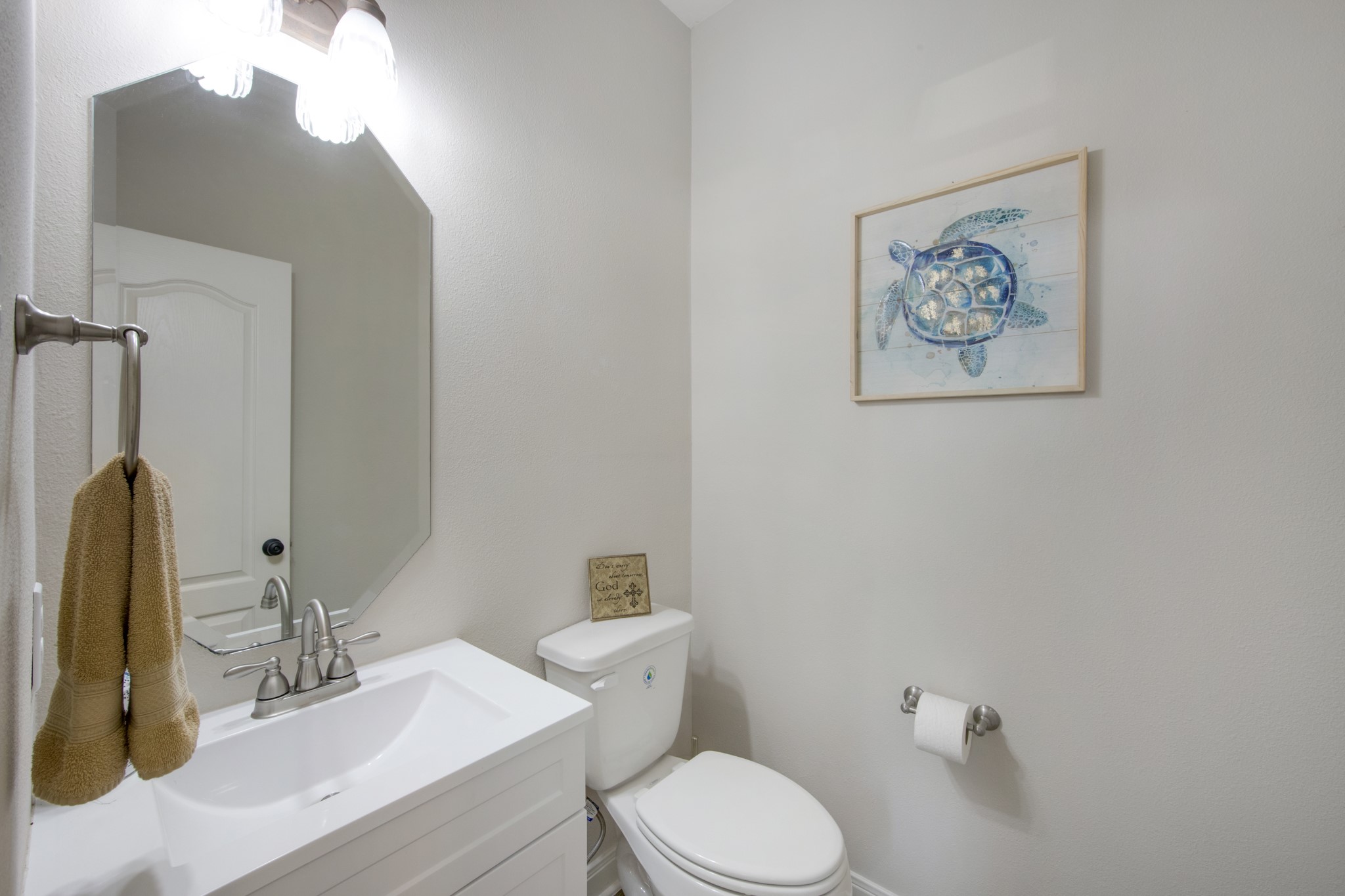 9510 Ashdown Forest Drive Spring, TX 77379 - Photo 21 of 50 HALF BATH – convenient guest powder room located on the main floor. Clean finishes and a bright vanity make this space both functional and welcoming for visitors.
