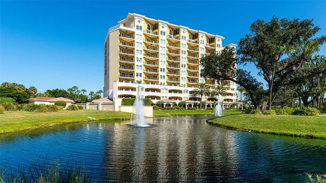 a view of swimming pool with outdoor space and lake view