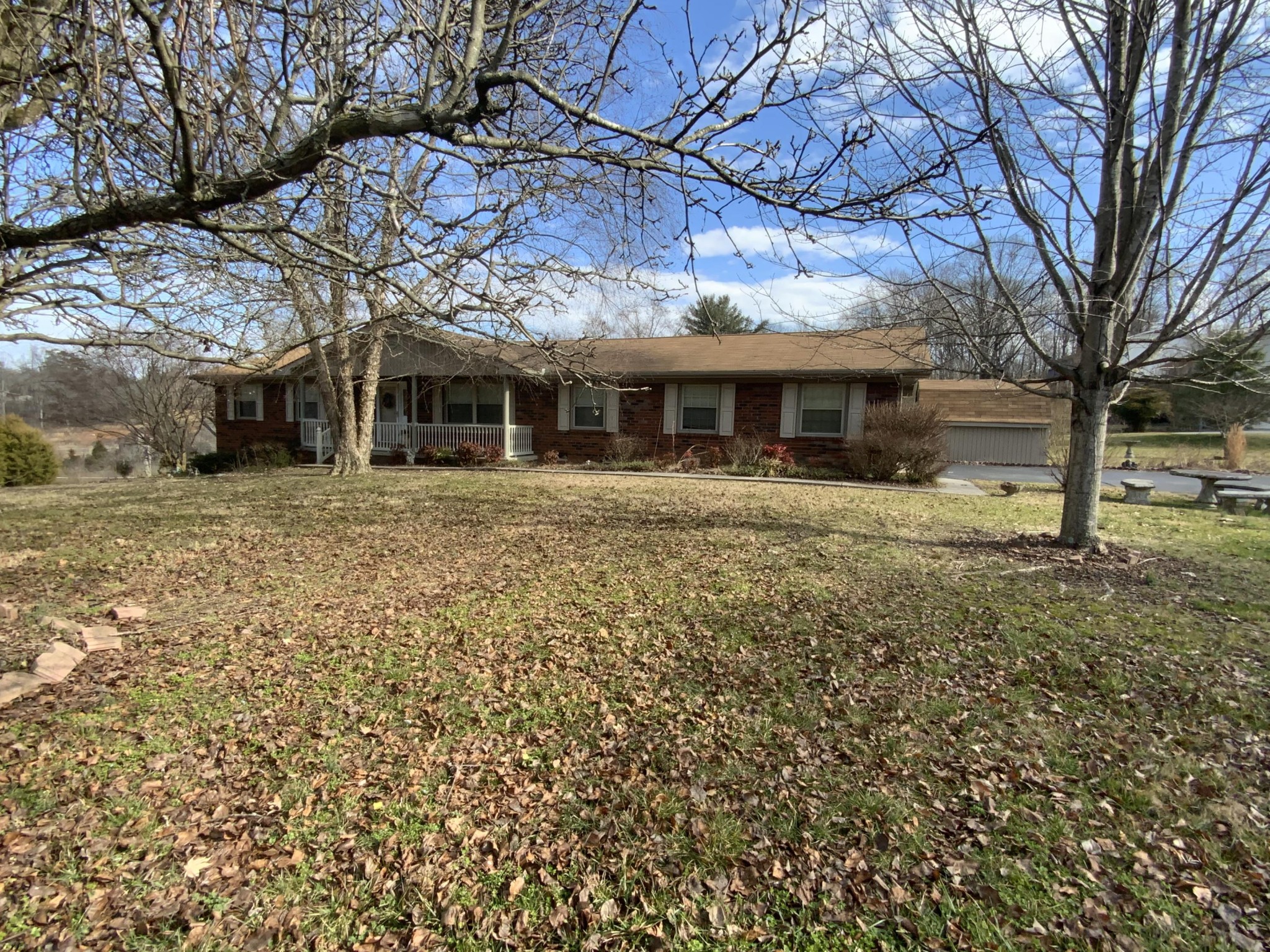 440 Orchard Knob Road Clinton, TN 37716 - Photo 1 of 3 a front view of a house with a garden