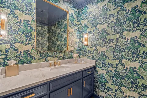 a bathroom with a sink and mirror