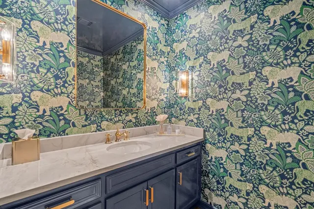 a bathroom with a sink and mirror