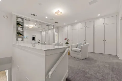a bathroom with a double vanity sink and mirror