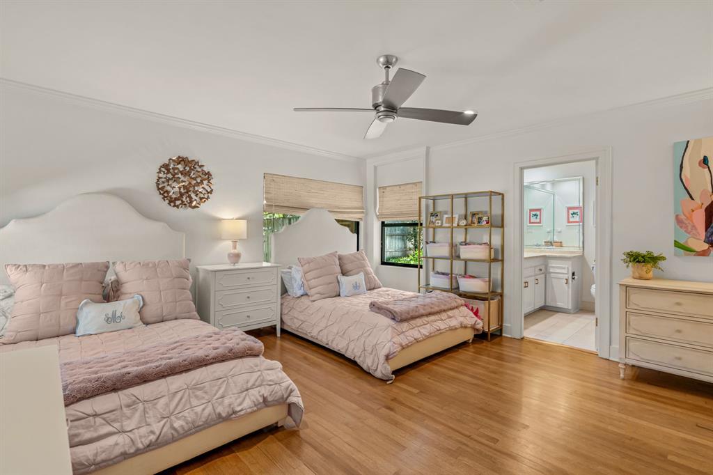 5849 Merrymount Road Westover Hills, TX 76107 - Photo 22 of 40 a bedroom with two beds and a window