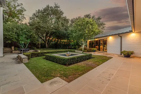 a view of a swimming pool with sitting area