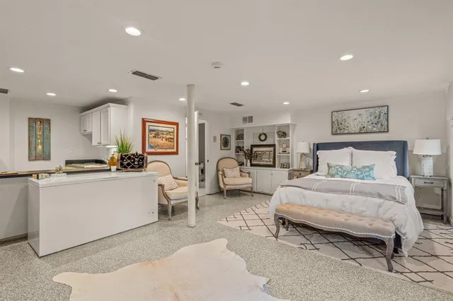 a living room with furniture a window and a table