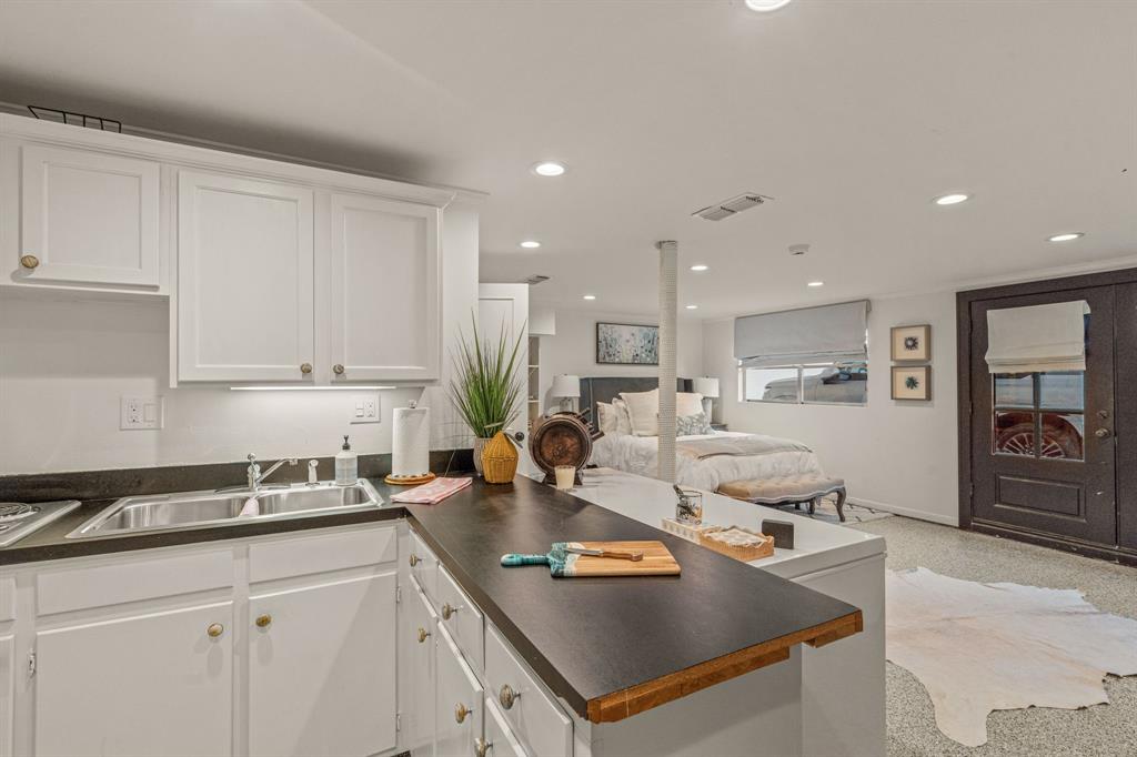 5849 Merrymount Road Westover Hills, TX 76107 - Photo 32 of 32 a kitchen with stainless steel appliances granite countertop a sink a stove and a refrigerator