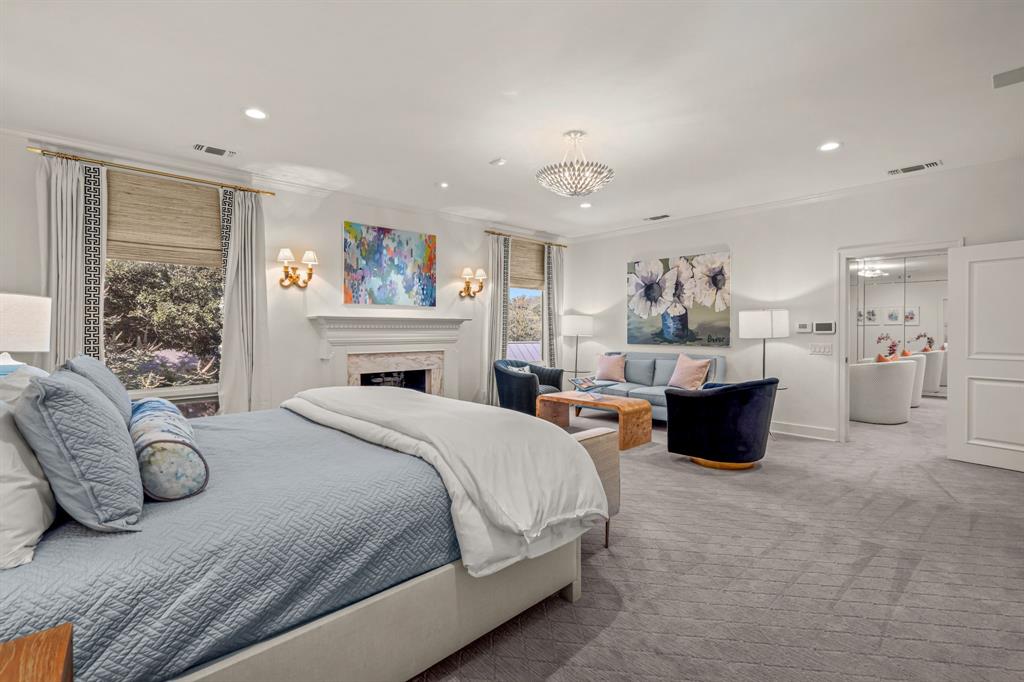 5849 Merrymount Road Westover Hills, TX 76107 - Photo 32 of 40 a spacious bedroom with a bed and a couch