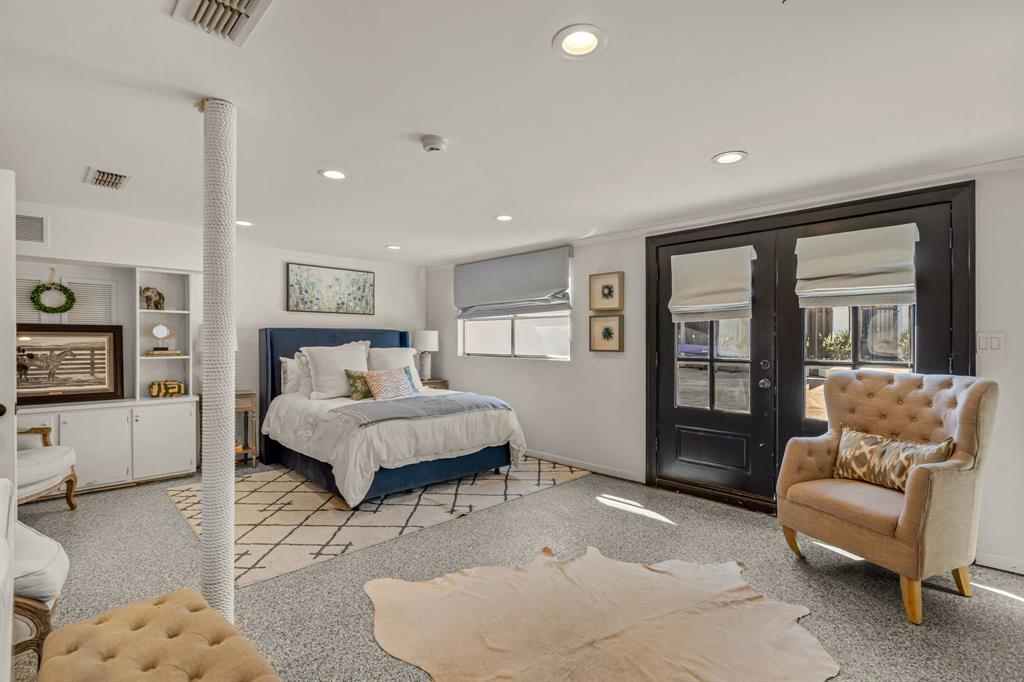 5849 Merrymount Road Westover Hills, TX 76107 - Photo 39 of 40 a spacious bedroom with a bed and a couch