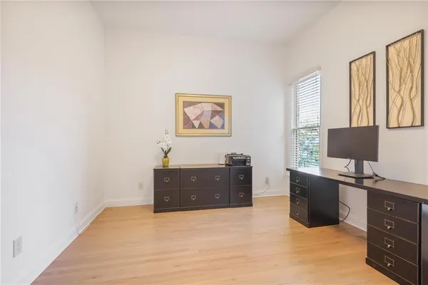 a bedroom with a bed couch and window