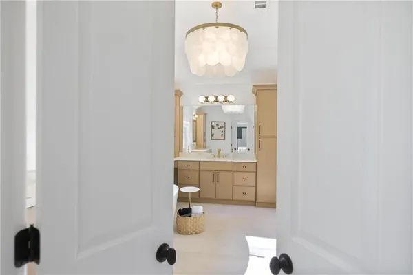 a bedroom with a large bed and a window