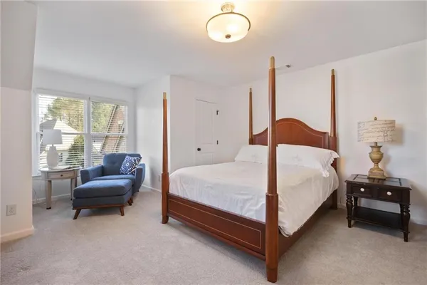 an aerial view of a house with a yard and garden