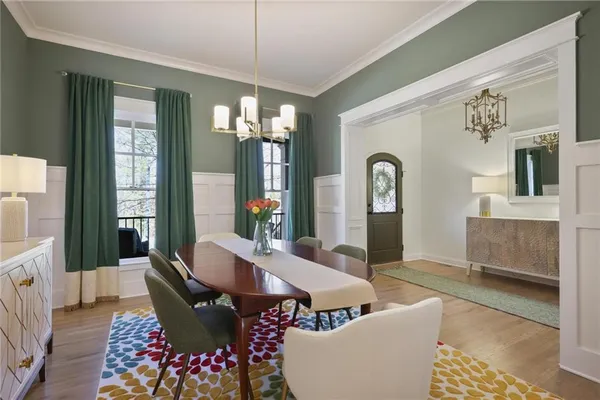 a view of a dining room with furniture and window