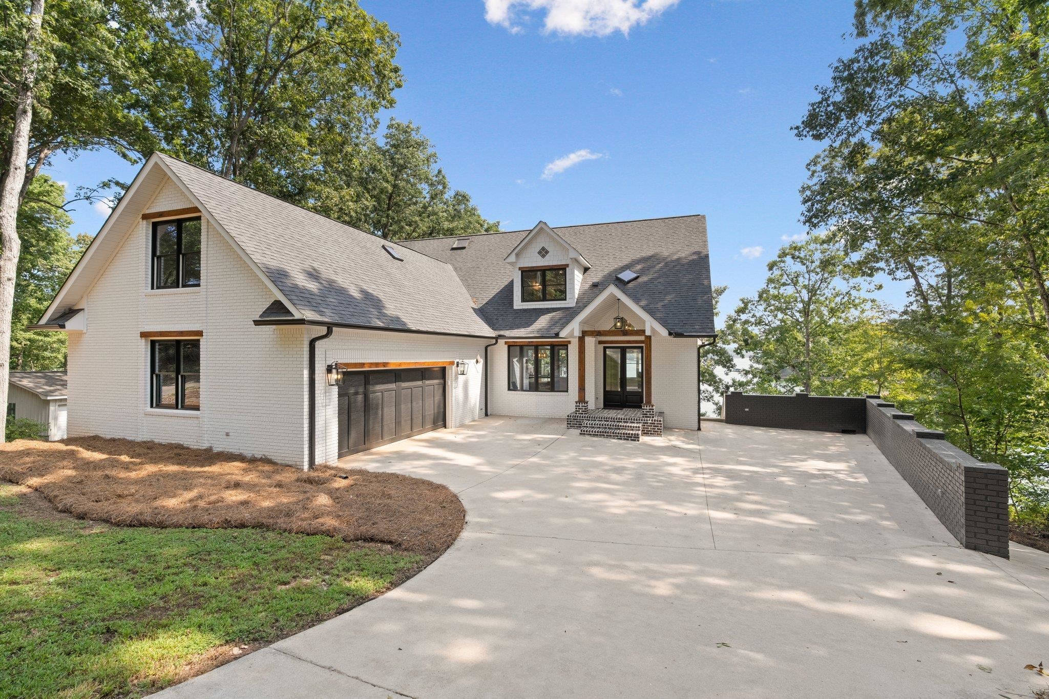774 Reed Creek Point Hartwell, GA 30643 - Photo 1 of 1 a front view of a house with a yard and garage