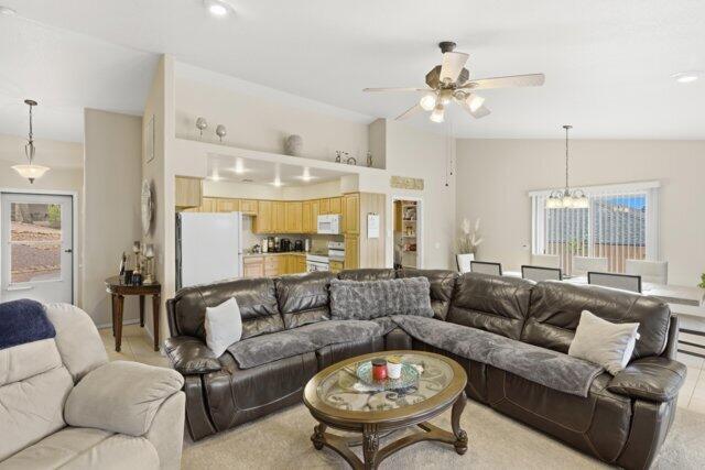 722 Boulder Ridge Road Payson, AZ 85541 - Photo 10 of 29 a living room with furniture a large window and a chandelier