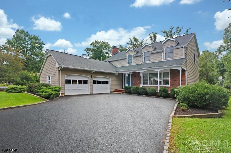 5 Sleepy Hollow Road Edison, NJ 08820 - Photo 1 of 24 a front view of a house with garden