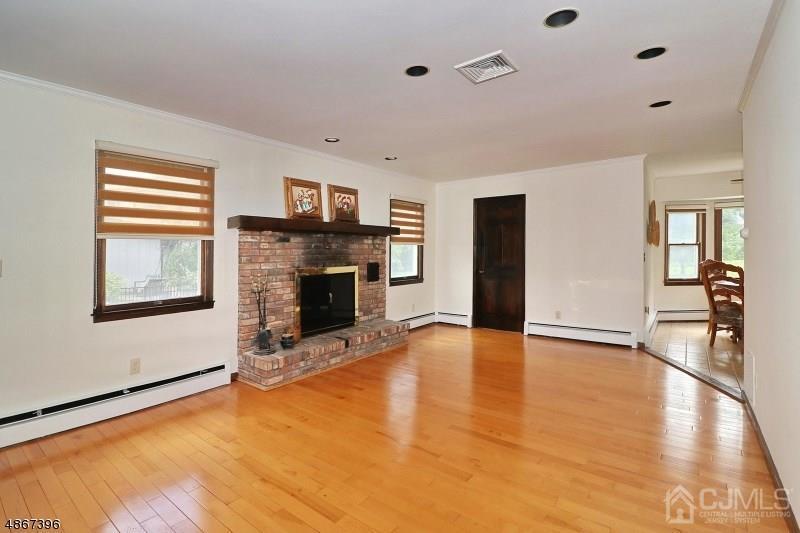 5 Sleepy Hollow Road Edison, NJ 08820 - Photo 12 of 24 a view of an empty room with window and fire place