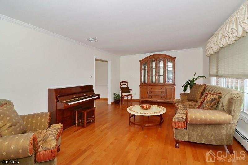 5 Sleepy Hollow Road Edison, NJ 08820 - Photo 13 of 24 a living room with furniture and a piano