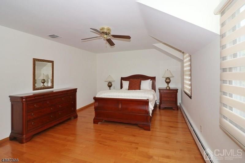 5 Sleepy Hollow Road Edison, NJ 08820 - Photo 16 of 24 a bedroom with a bed and window