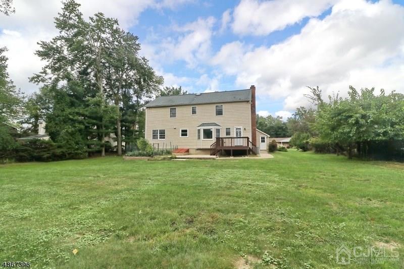 5 Sleepy Hollow Road Edison, NJ 08820 - Photo 23 of 24 a view of a house with backyard
