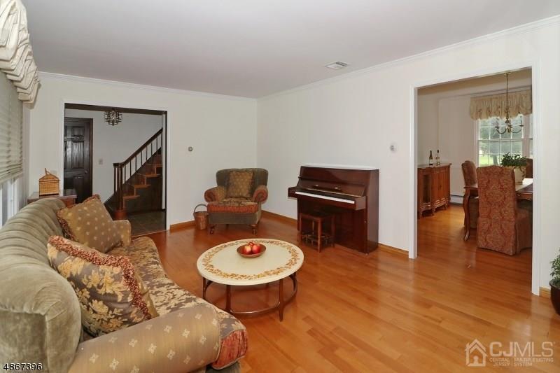 5 Sleepy Hollow Road Edison, NJ 08820 - Photo 6 of 24 a living room with furniture and wooden floor