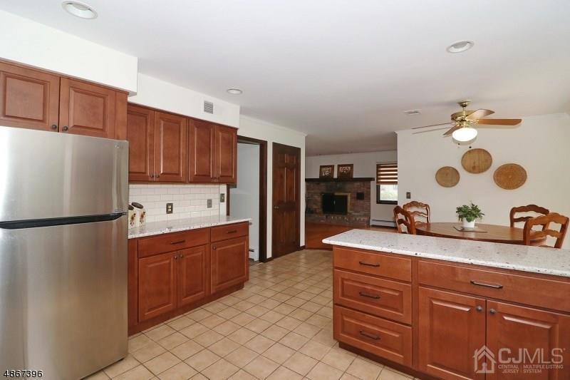 5 Sleepy Hollow Road Edison, NJ 08820 - Photo 9 of 24 a kitchen with stainless steel appliances granite countertop a refrigerator and a sink