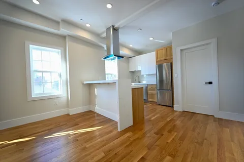 a view of kitchen with stainless steel appliances refrigerator microwave and stove