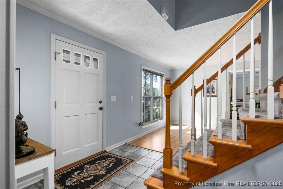 59 Prestige Drive Cameron, NC 28326 - Photo 2 of 36 a view of front door with hallway and a livingroom