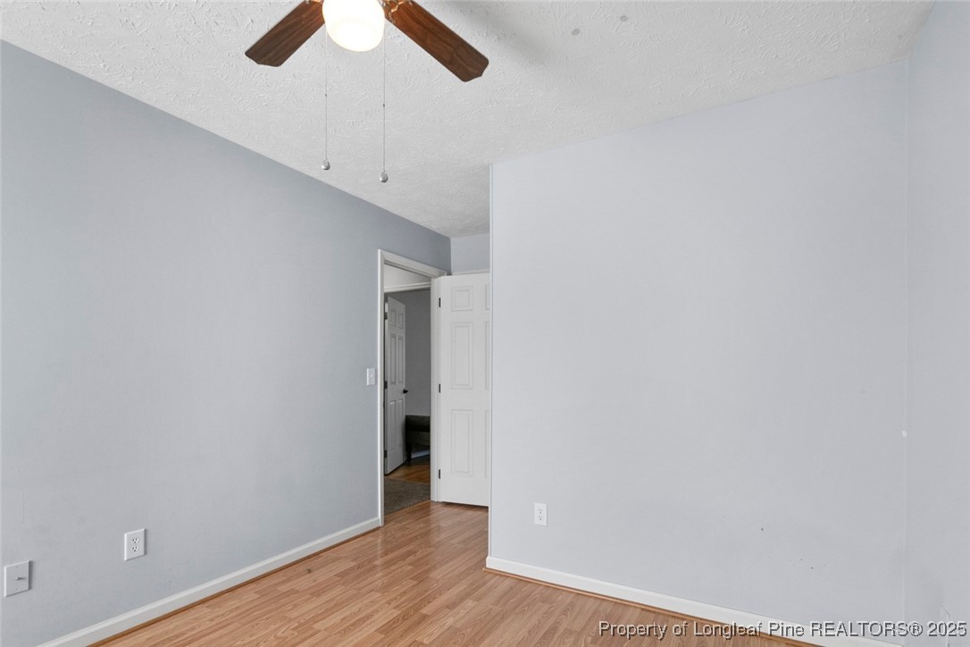 59 Prestige Drive Cameron, NC 28326 - Photo 24 of 36 a view of an empty room with wooden floor